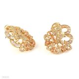 Majestic twisting baguette champagne gold earrings