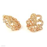 Majestic twisting baguette champagne gold earrings