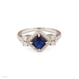 Astonishing blue diamond halo ring