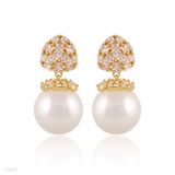 Dainty gold pearl earrings