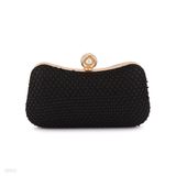 Shiny textured black pearl crown clutch